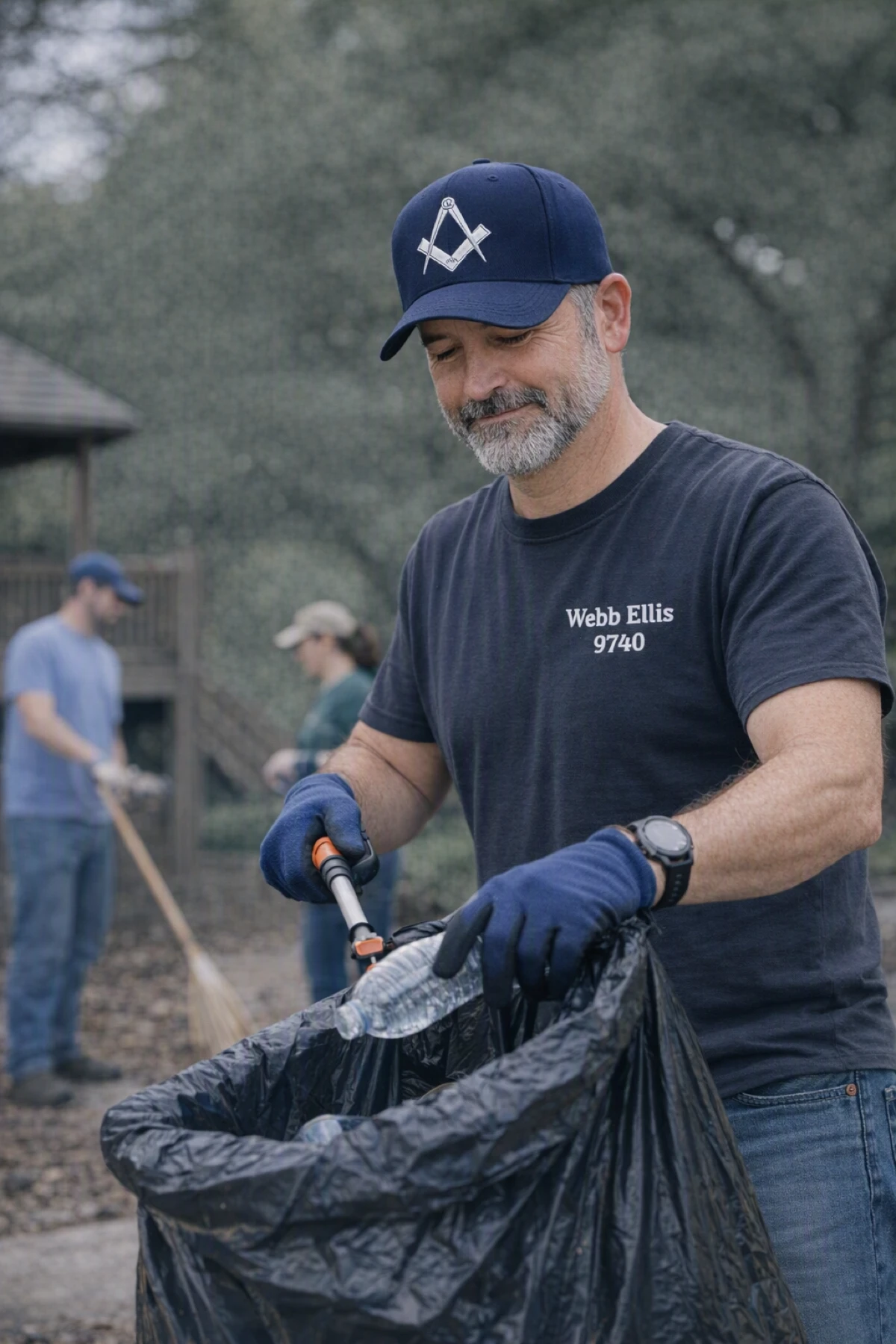 A volunteer collecting litter outdoors