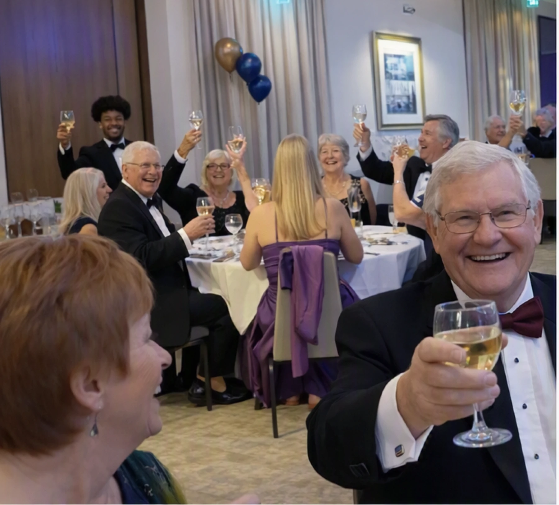 Members and guests enjoying an indoor social event