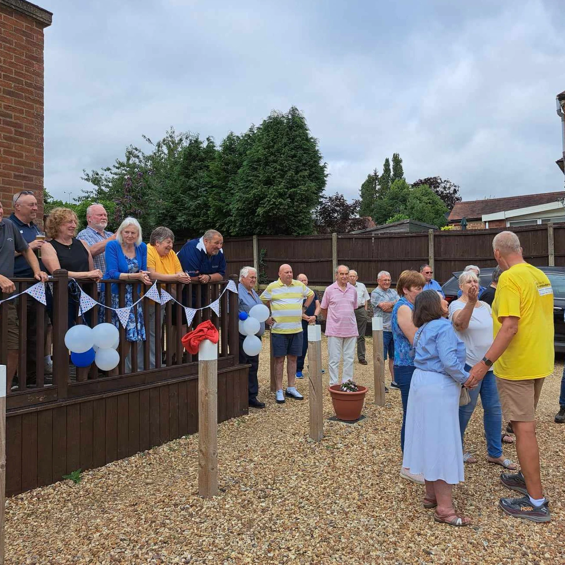 Members and friends enjoying an outdoor lodge social