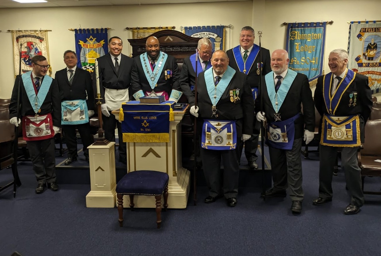 Webb Ellis Lodge members standing together in rugby ties